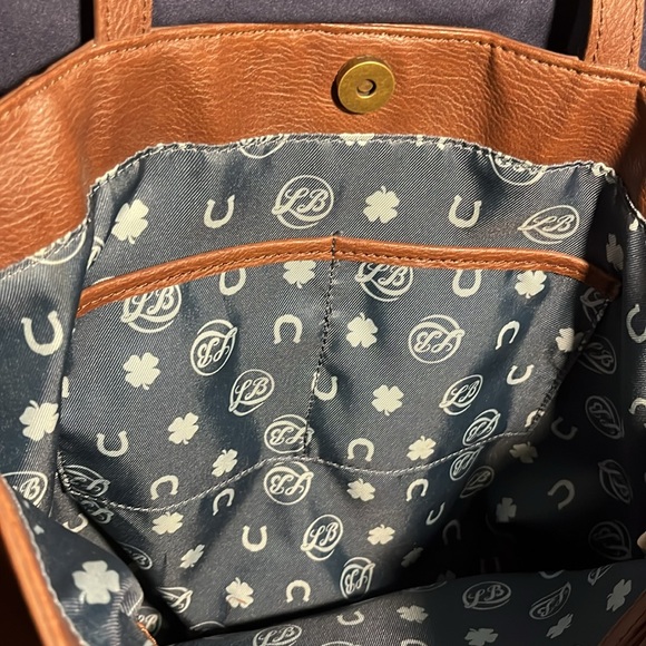 Lucky Brand brown studded purse with cutouts and Teal & horseshoe print lining. - Picture 4 of 8